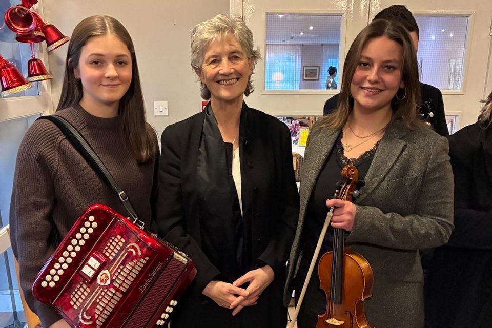 Musicians Kitty Sabry and Eimear Clancy with President Catherine Connolly in Kinvara, Co Galway